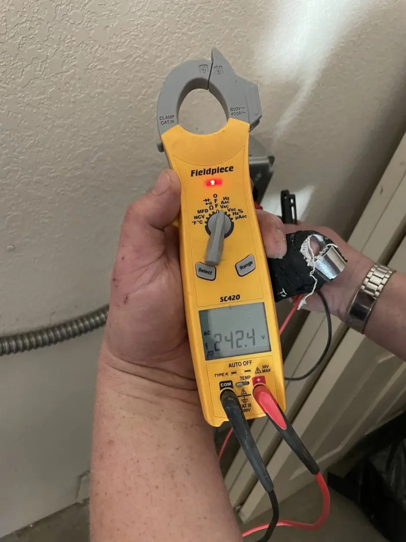 Voltage testing with clamp meter during Generator Installation in Heath